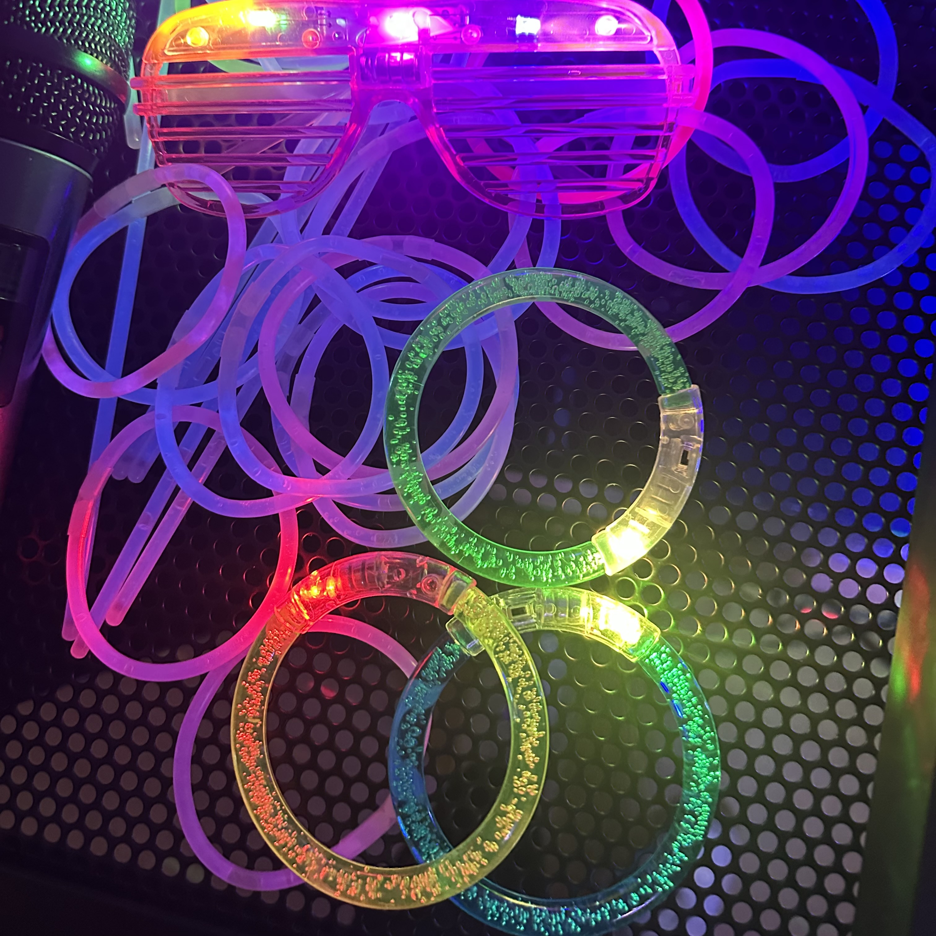 Glow bracelets and LED sunglasses at a party